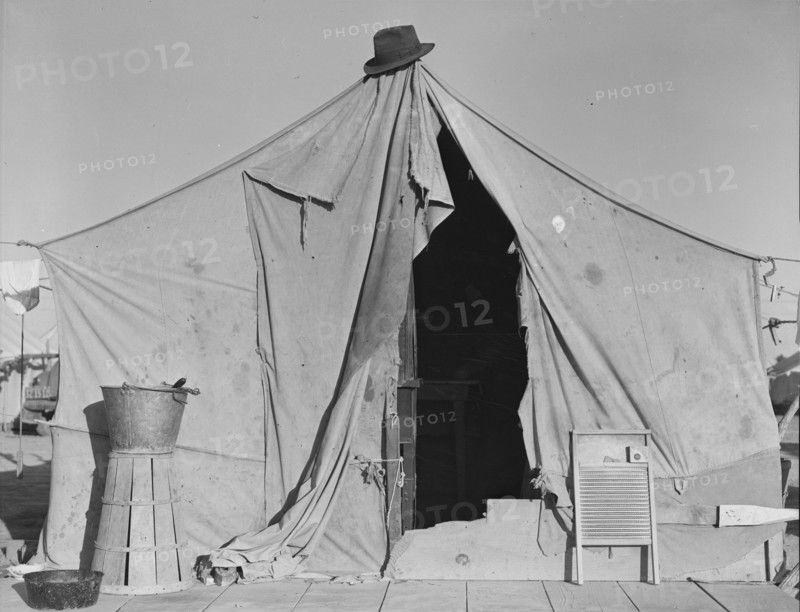 One of a row of tents, home of a pea picker, near Calipatria, Imperial Valley, California, 1939. Creator: Dorothea Lange.