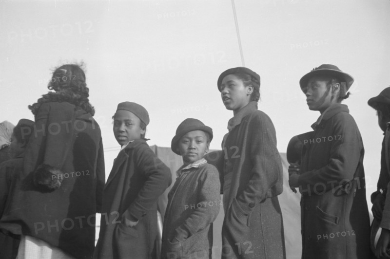 Possibly: Negroes in the lineup for food at meal time in the camp..., Forrest City, Arkansas, 1937. Creator: Walker Evans.