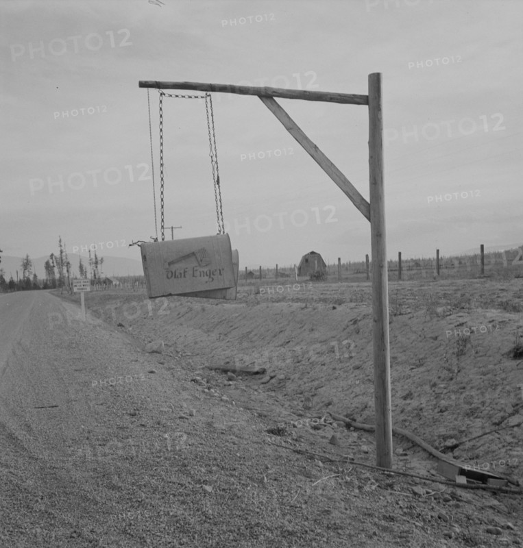 Swinging mail boxes in country where snow is deep in winter, Boundary County, Idaho, 1939. Creator: Dorothea Lange.