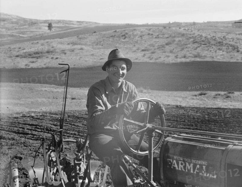 Young farmer, member of Ola self-help sawmill co-op, plowing..., Gem County, Idaho, 1939. Creator: Dorothea Lange.