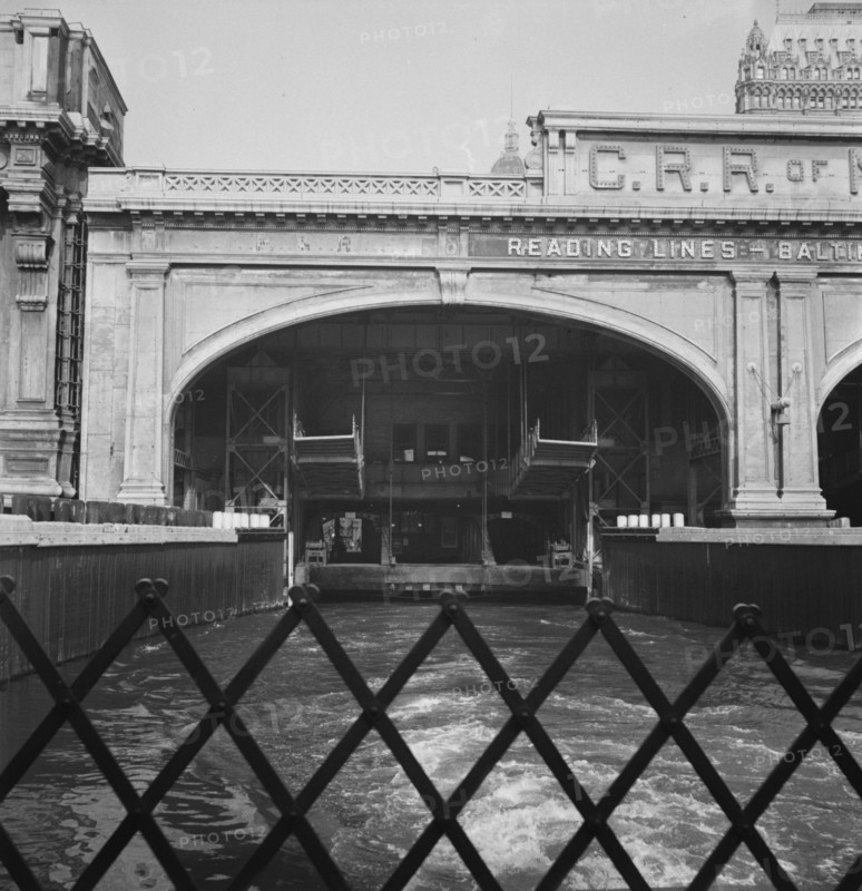 Ferry slip seen from ferry which transports passengers across the Hudson..., New York City, 1939. Creator: Dorothea Lange.