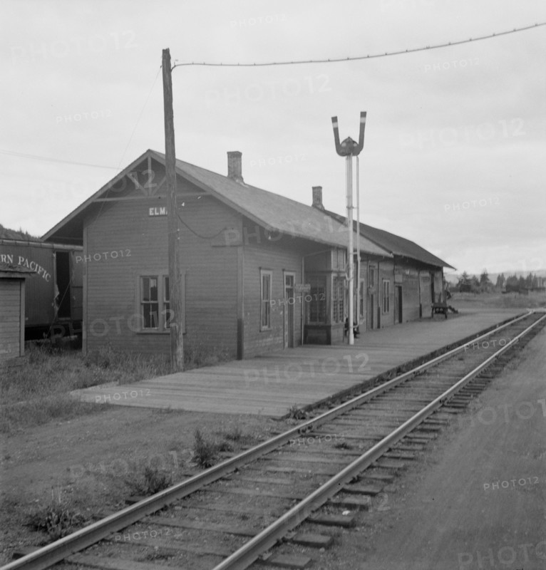Possibly: Railroad station of western Washington town, Elma, Harbor County, Western Washington, 1939 Creator: Dorothea Lange.