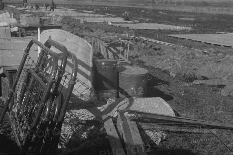 Possibly: Setting up a tent in the camp for white flood refugees, Forrest City, Arkansas, 1937. Creator: Walker Evans.