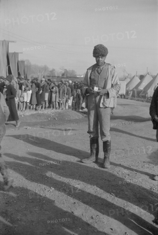 Possibly: Negro with a fur cap, a flood refugee in the camp at Forrest City, Arkansas, 1937. Creator: Walker Evans.