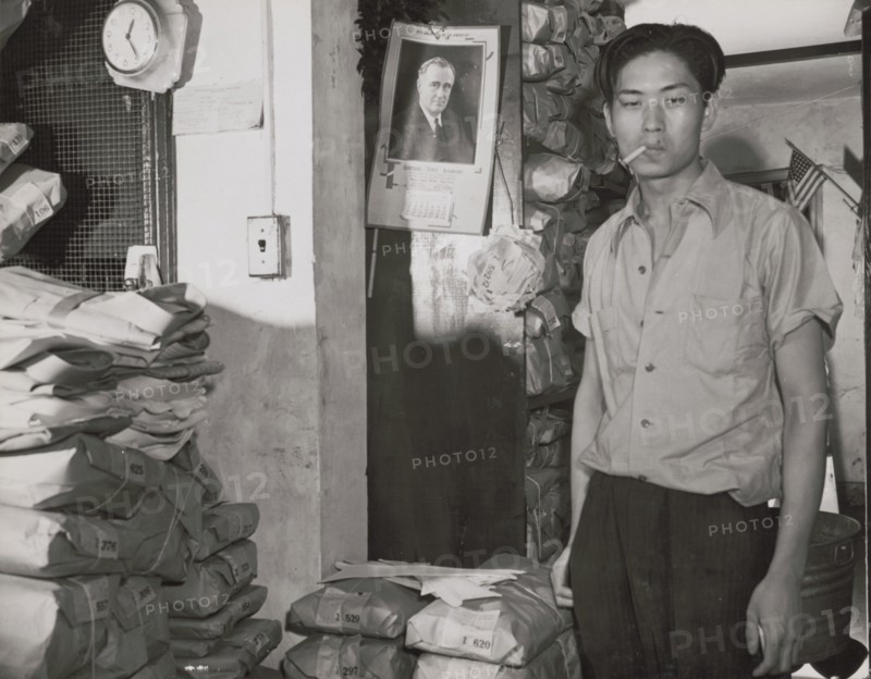 Johnnie Lew, owner of the laundry under the apartment of Mrs. Ella..., Washington, D.C., 1942. Creator: Gordon Parks.