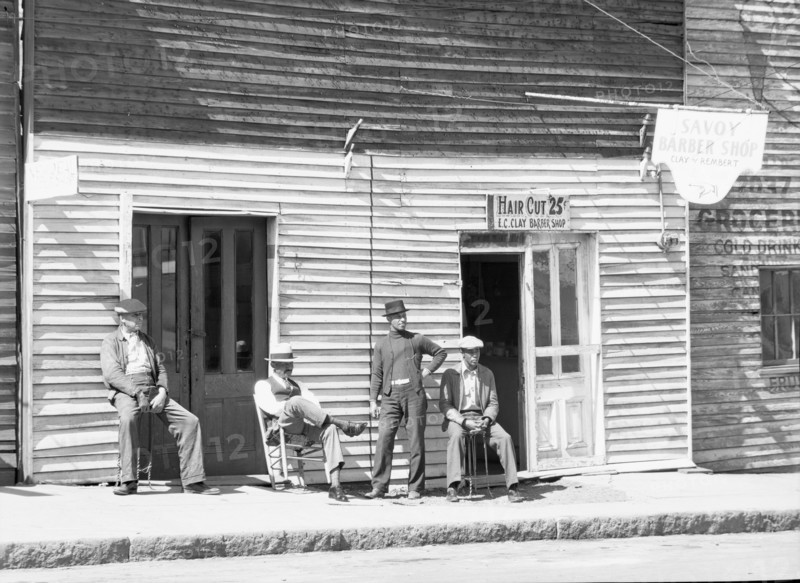 Vicksburg Negroes and shop front, Mississippi, 1936. Creator: Walker Evans.