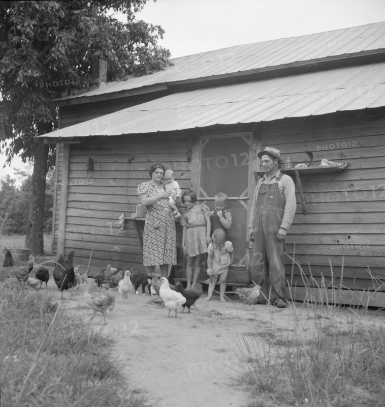 Possibly: Tobacco sharecropper with his oldest daughter, Person County, North Carolina, 1939. Creator: Dorothea Lange.