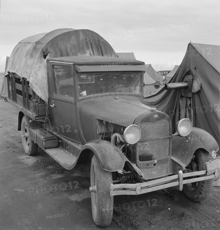Truck, baby parked on front seat, Merrill, Klamath County, Oregon, 1939. Creator: Dorothea Lange.