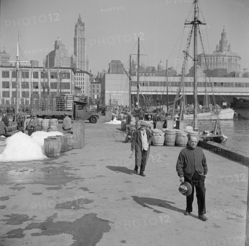Possibly: Barrels of fish on the docks at Fulton fish market ready to be shipped..., New York, 1943. Creator: Gordon Parks.
