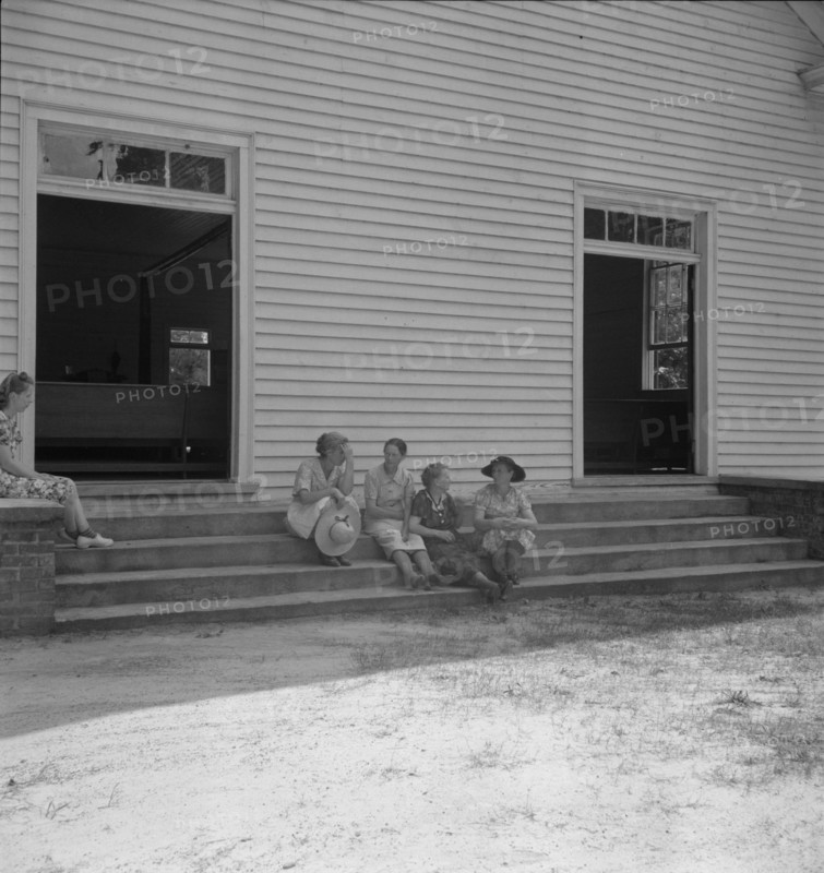 Conversation among members of congregation, Wheeley's Church, Gordonton, N Carolina, 1939. Creator: Dorothea Lange.