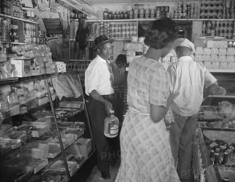Interior of the grocery store patronized by Mrs. Ella Watson..., Washington, D.C., 1942. Creator: Gordon Parks.