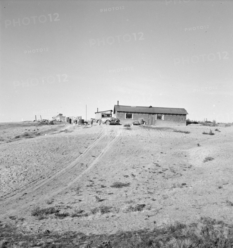 The Browning home, a partial dugout, Dead Ox Flat, Malheur County, Oregon, 1939. Creator: Dorothea Lange.