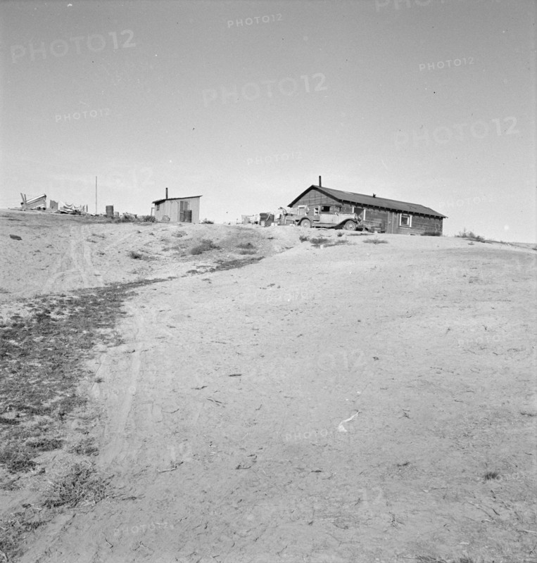 The Browning home, a partial dugout, Dead Ox Flat, Malheur County, Oregon, 1939. Creator: Dorothea Lange.