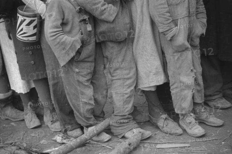 Negroes in the lineup for food at mealtime in the camp for flood refugees, Forrest City, Arkansas.