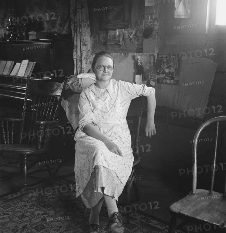 Mrs. Hull, in one room basement dugout home, late afternoon. Dead Ox Flat, Malheur County, Oregon.