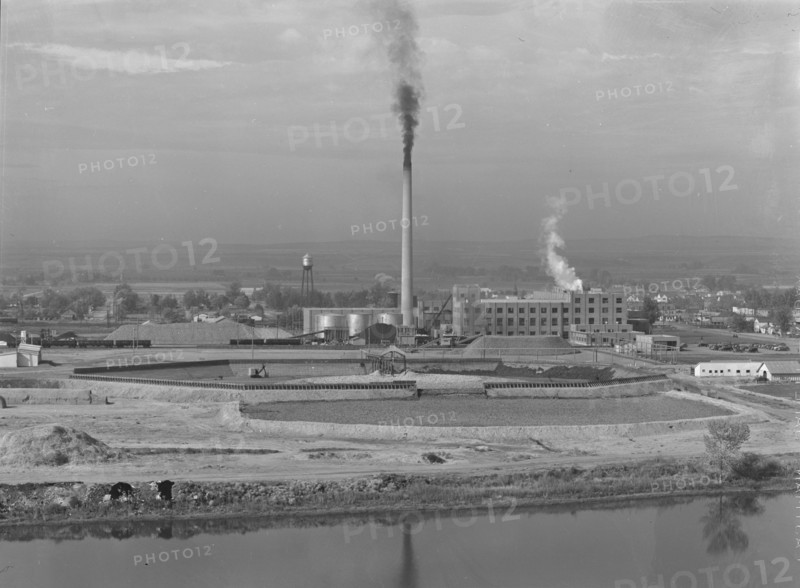 Sugar beet factory along Snake River. Shows beet dump, beet pile. Nyssa, Malheur County, Oregon.