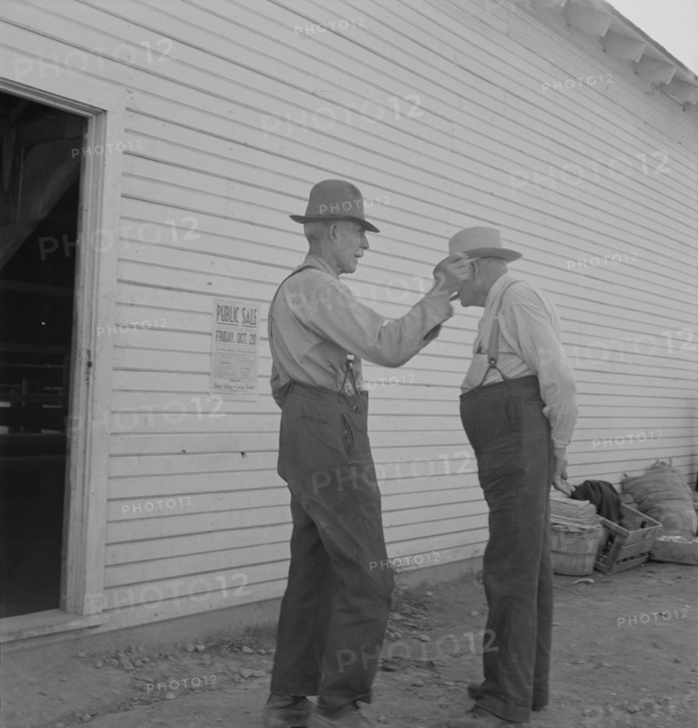 Oregon farmers, old settlers, at farmer's public sale, Saturday. Nyssa, Malheur County, Oregon.