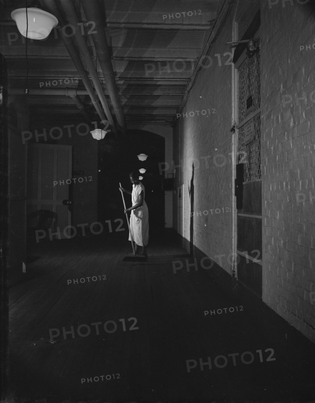 Washington, D.C. Government charwoman cleaning after regular working hours. [Mrs Ella Watson].