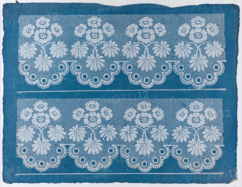 Blue sheet with two borders with a white floral and lace pattern, late 18th-mid-19th century.