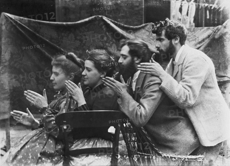 Esther Pissarro, Alice Isaacson, Lucien and Georges Pissarro pretending to be a train, 1890.