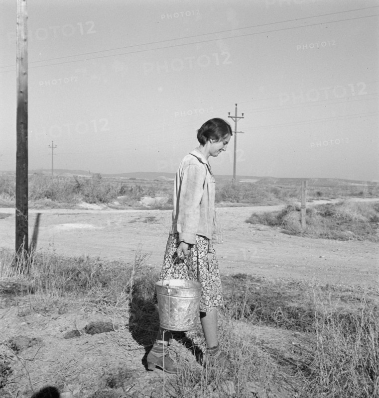 Mrs. Bartheloma hauls water from irrigation ditch. Nyssa Heights, Malheur County, Oregon.
