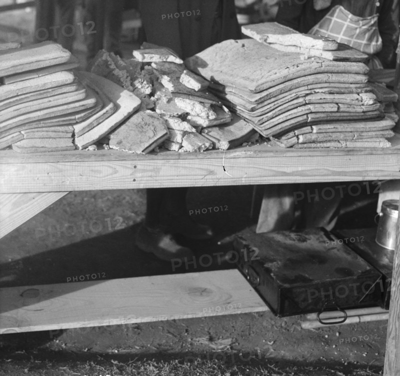 Cornbread. Food for flood refugees at the Forrest City concentration camp. Arkansas.