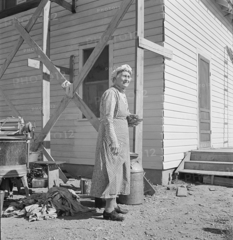 Soper grandmother helps the large family. Willow Creek area, Malheur County, Oregon.