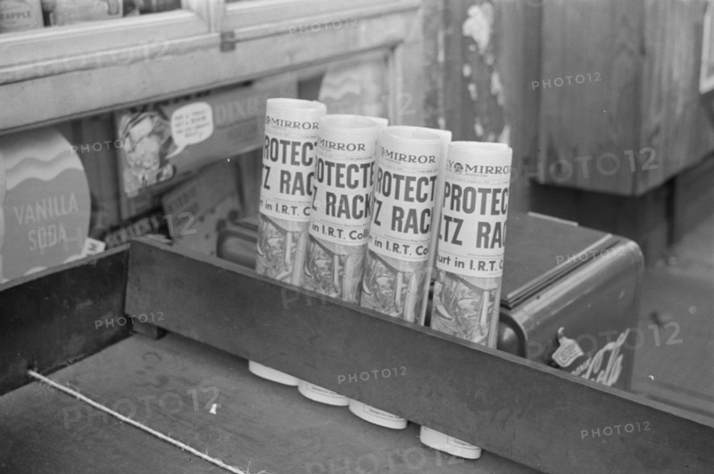 New York, New York. 61st Street between 1st and 3rd Avenues. Newspapers for sale.