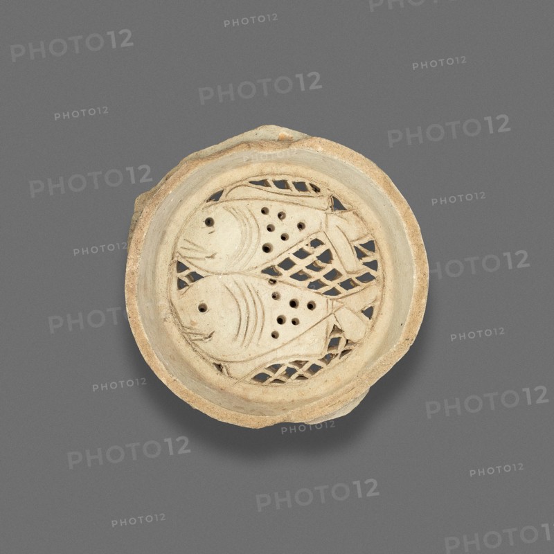 Clay filter with design of fish, Fatimid dynasty (969-1171), 11th-12th century.