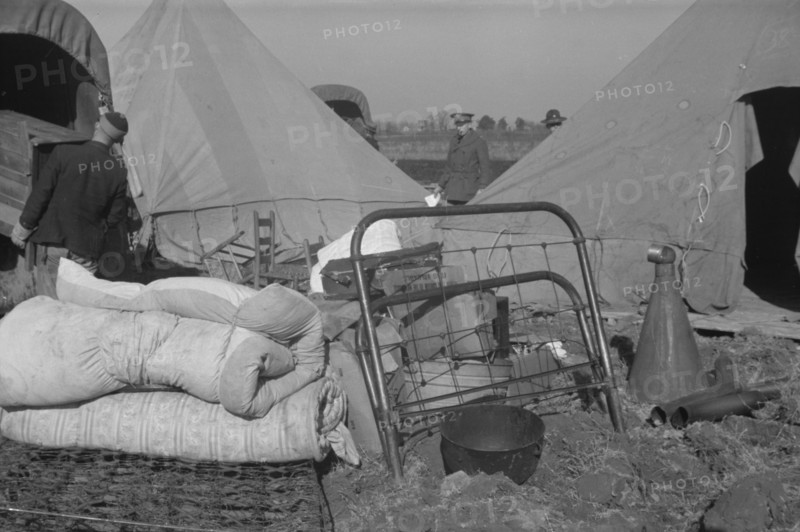 Setting up a tent in the camp for white flood refugees, Forrest City, Arkansas.