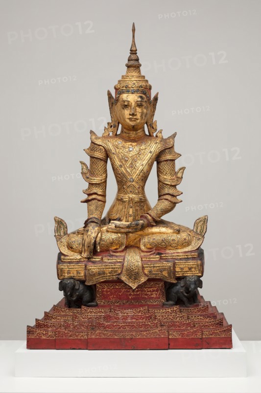 Crowned and Bejewelled Buddha Seated on an Elephant Throne, Late 19th century.