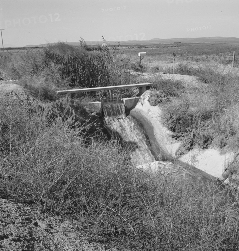 Irrigation ditch, showing drop in canal. Dead Ox Flat, Malheur County, Oregon.