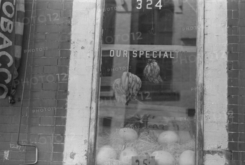 New York, New York. 61st Street between 1st and 3rd Avenues. A shop window.