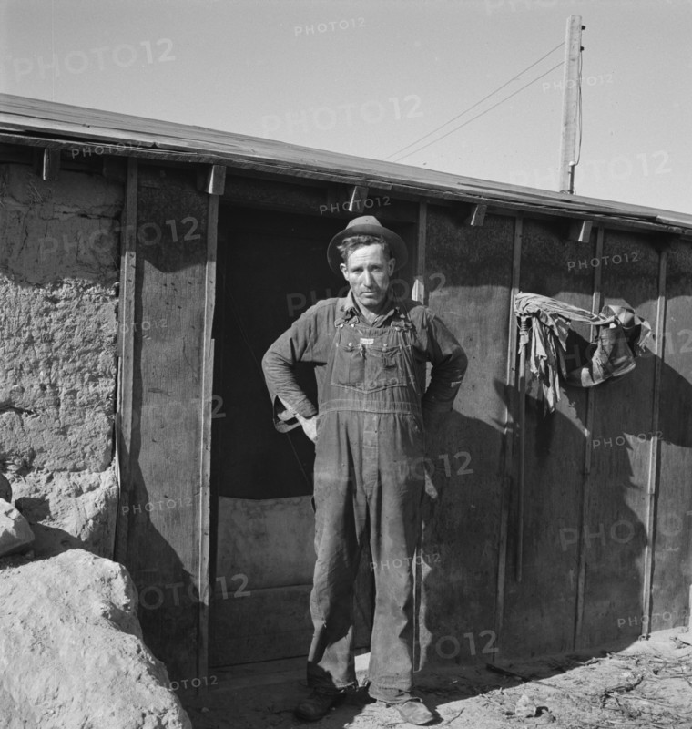 Mr. Roberts in front of his Owyhee project home. Malheur County, Oregon.