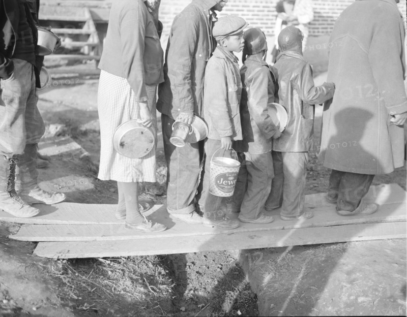 Negroes waiting for food in the Forrest City, Arkansas, refugee camp.