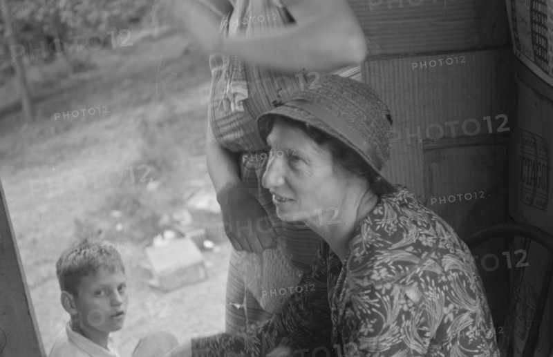 Farm woman in conversation with relief investigator, West Virginia.