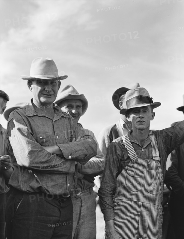 Watching ball game. Shafter camp for migrants. California.