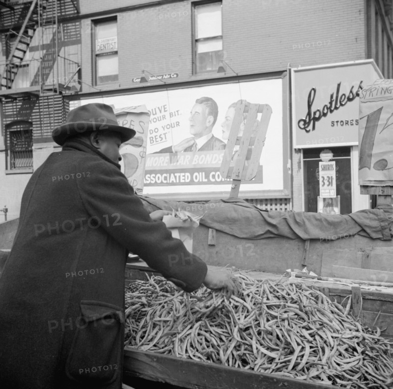 New York, New York. Street peddler in the Harlem section.