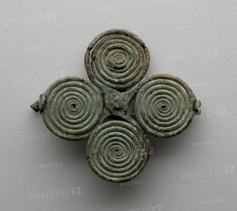 Quatrefoil spiral fibula (garment pin), 7th century BCE.