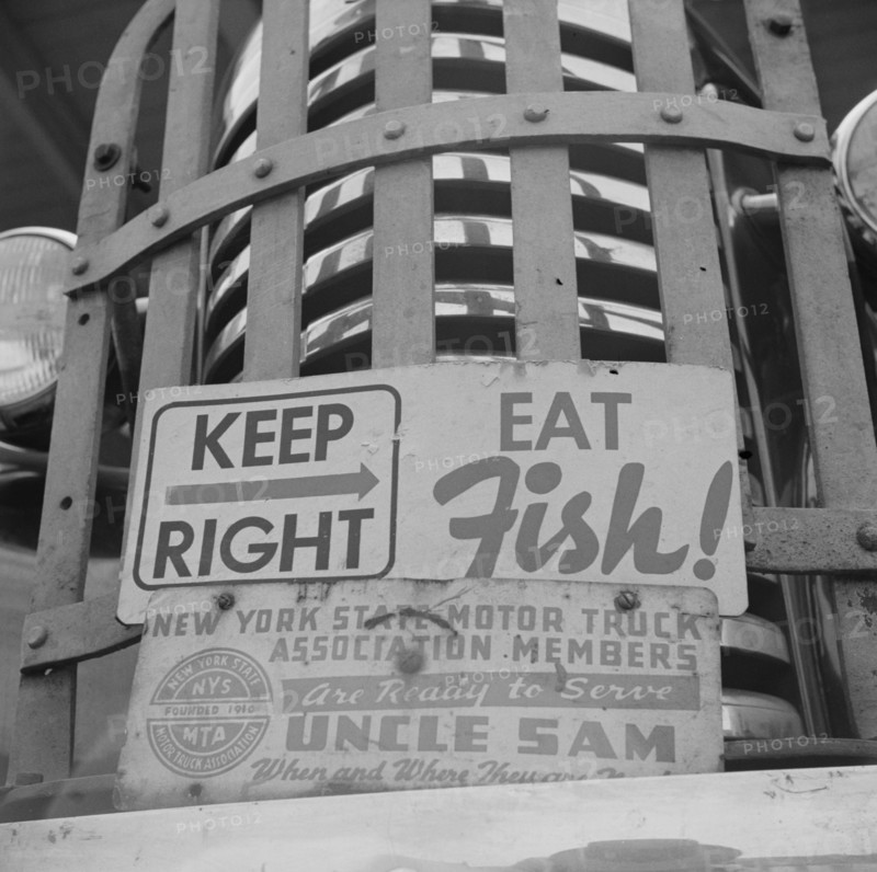 New York, New York. Sign on front of a motor truck.