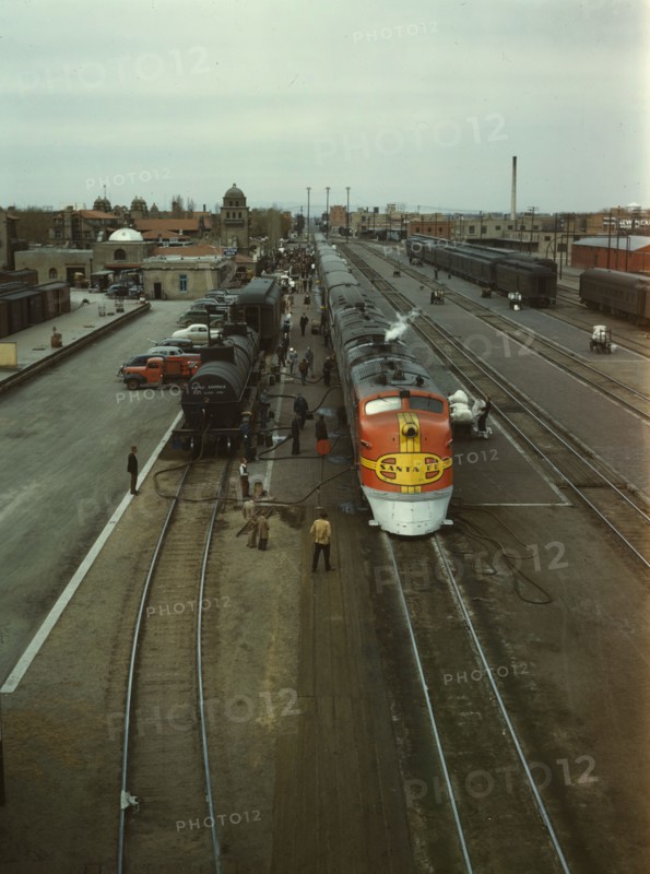 Santa Fe R.R. streamliner, the "Super Chief," being serviced..., Albuquerque, N.Mexico, 1943. Creator: Jack Delano.
