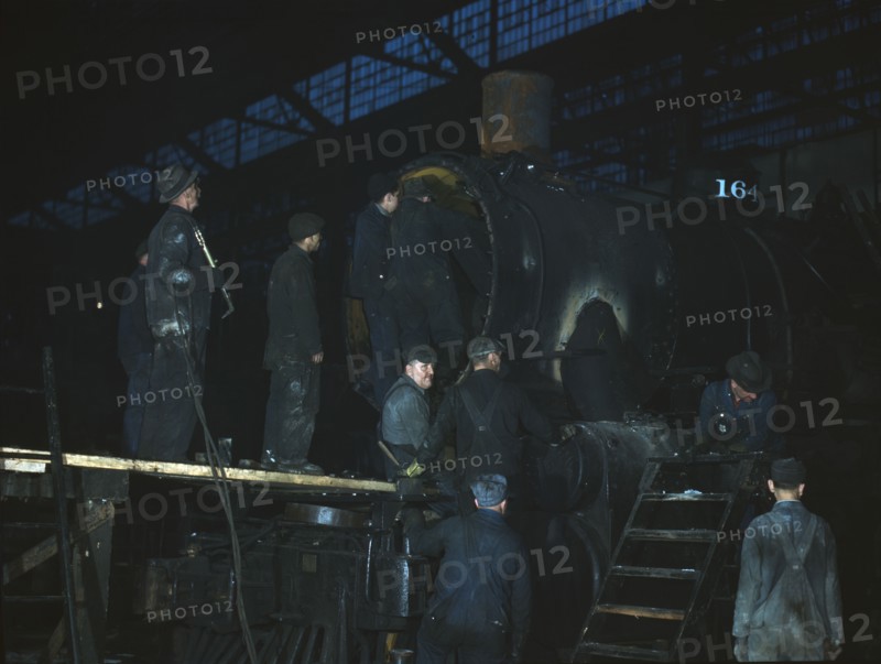 Working on a locomotive at the 40th Street shop of the C & NW RR, Chicago, Ill., 1942. Creator: Jack Delano.