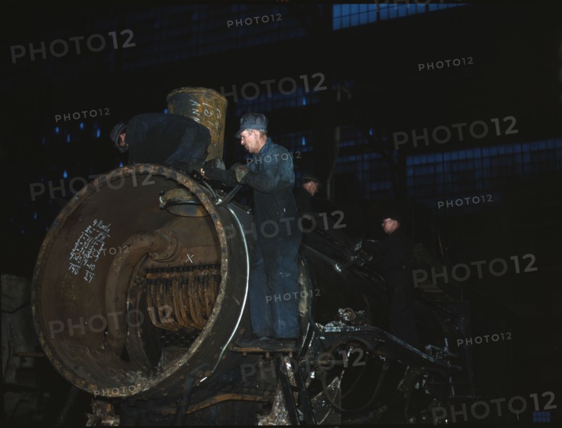 Working on the boiler of a locomotive at the 40th Street shops of the C & NW RR, Chicago, Ill., 1942 Creator: Jack Delano.