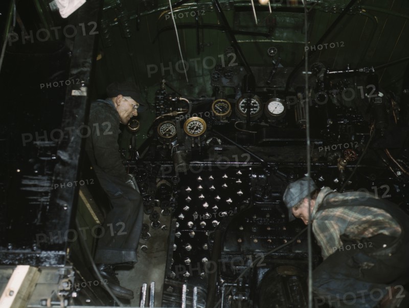 Working on the cab of a locomotive brought in for repair at the C & NW RR, Chicago, Ill., 1942. Creator: Jack Delano.