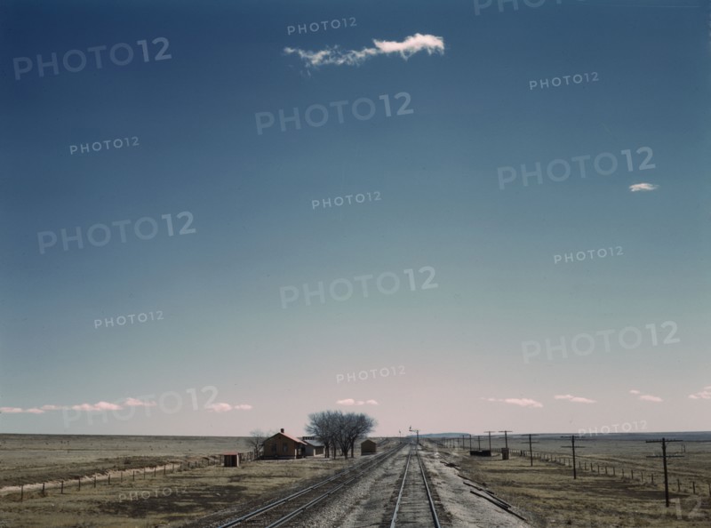 Passing a section house along the Atchison, Topeka, and Santa Fe railroad, New Mexico, 1943. Creator: Jack Delano.