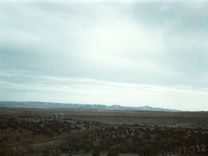 Santa Fe R.R. freight train rounding a curve between Ash Fork and Gleed, Arizona, 1943. Creator: Jack Delano.