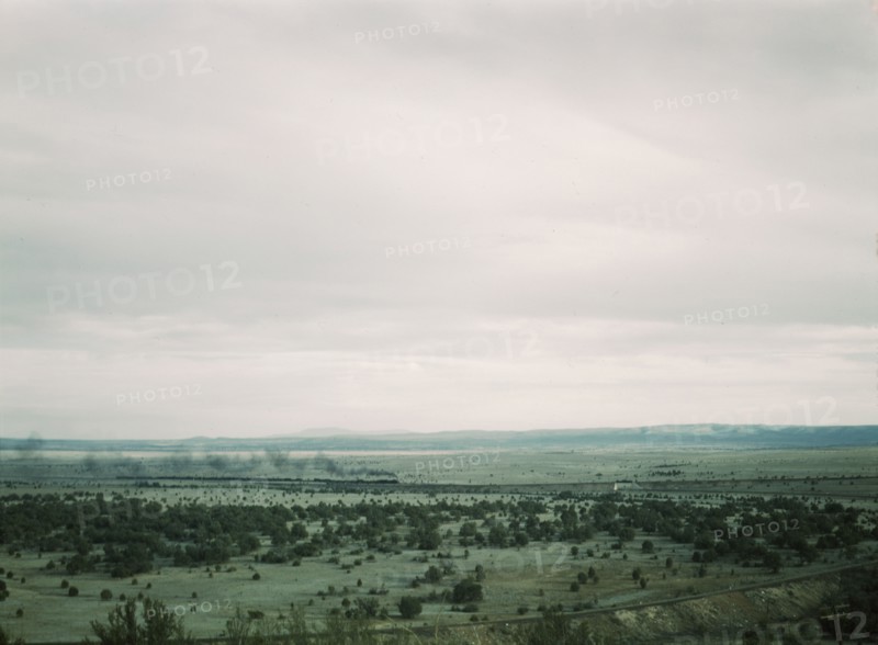 Santa Fe R.R. freight train rounding a curve between Ash Fork and Gleed, Arizona, 1943. Creator: Jack Delano.
