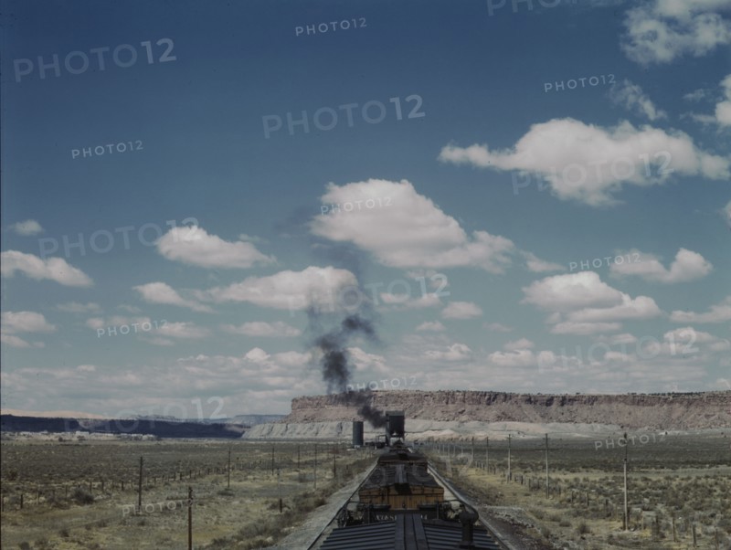 Santa Fe R.R. train stopping for coal and water, Laguna, New Mexico, 1943. Creator: Jack Delano.
