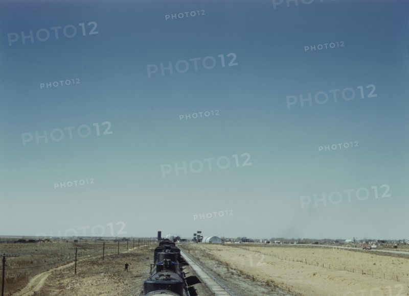 Westbound freight train stopping for water, Melrose, New Mexico, 1943. Creator: Jack Delano.