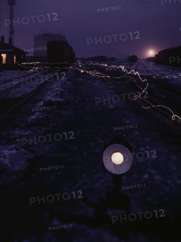 View in a departure yard at C & NW RR's Proviso (?) yard at twilight, Chicago, Ill., 1942. Creator: Jack Delano.